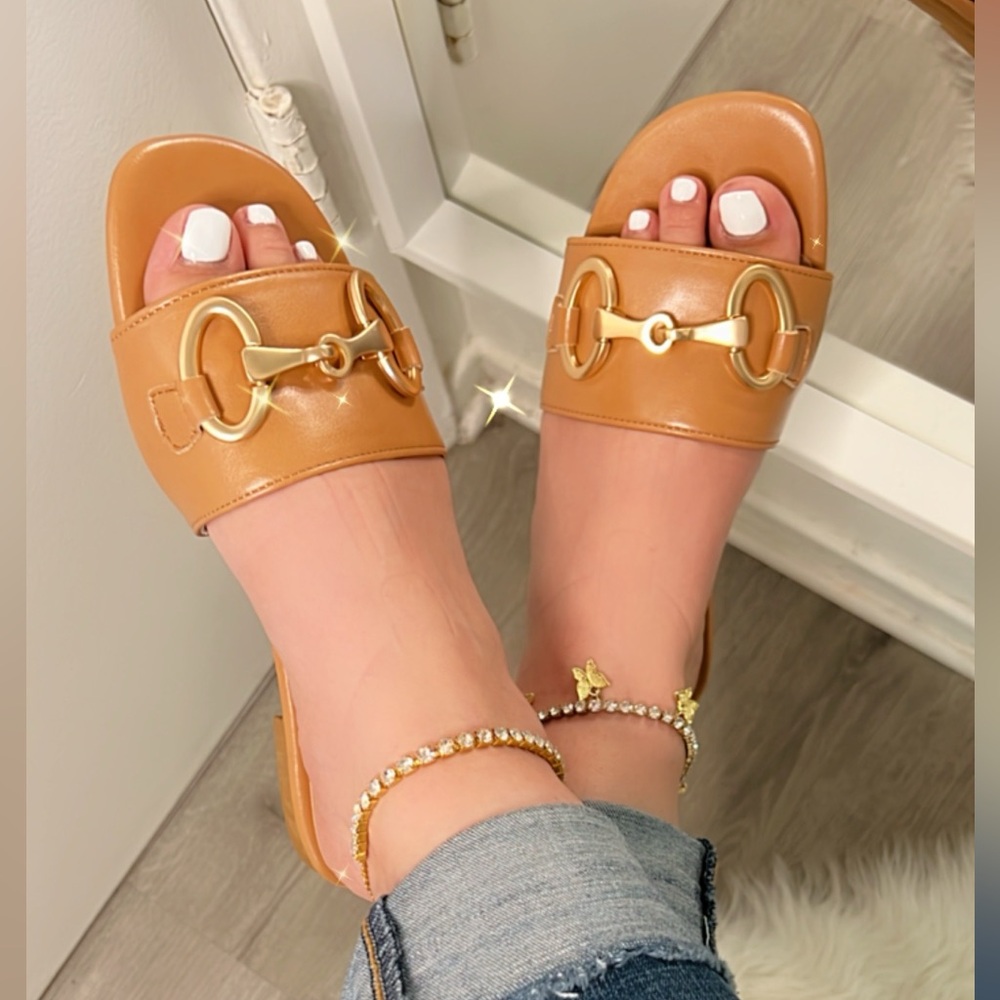 Tan sandals with gold hardware
